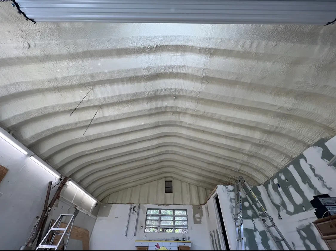 Spray polyurethane foam applied to the underside of a metal roof deck in Jensen Beach